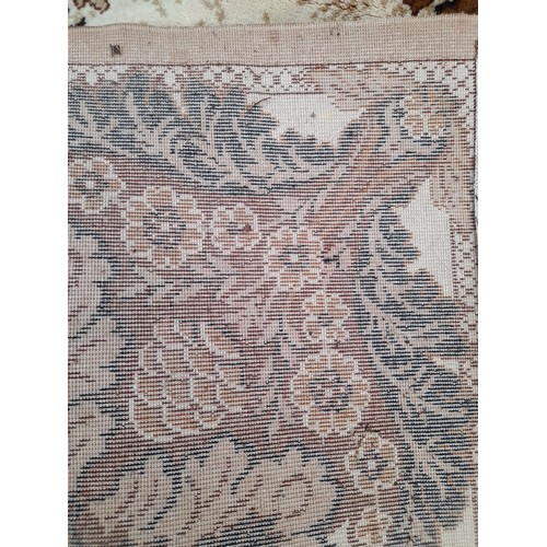 58 - Large Brown ground rug with central design, 390cm x 300cm