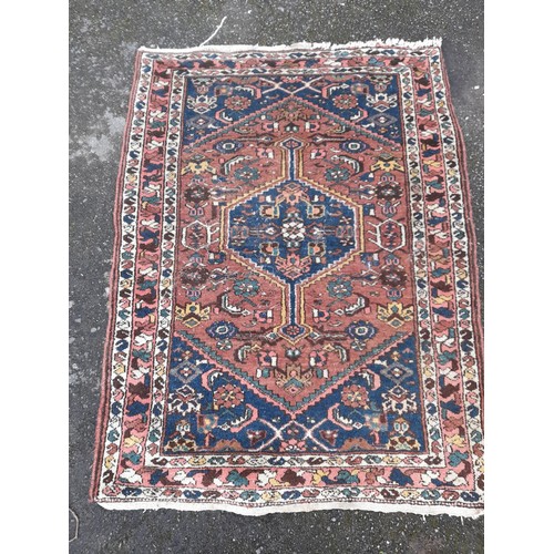 56 - Hand Knotted Red and Blue ground small rug, 138cm x 103cm