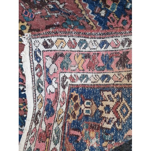 56 - Hand Knotted Red and Blue ground small rug, 138cm x 103cm