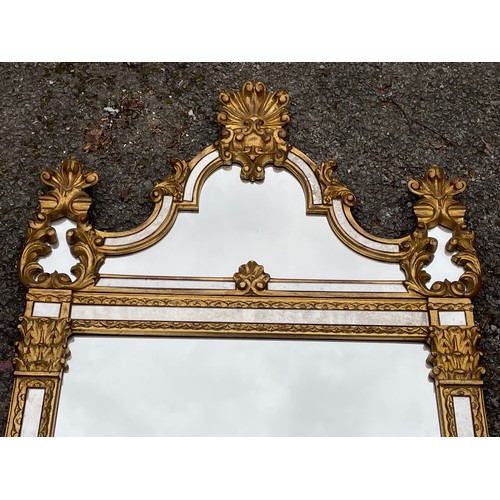 66 - Gilt Decorative Mirror. 126 x 65 cms