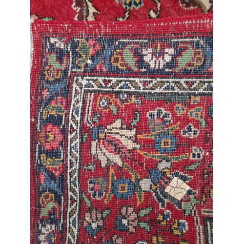 50A - Extra Large Red ground hand knotted Rug with large central motif, 400cm x 300cm