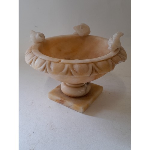 13 - Small Alabaster Urn with bird decoration,8cm high x 12cm. total height with birds 10cm