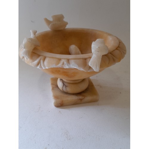 13 - Small Alabaster Urn with bird decoration,8cm high x 12cm. total height with birds 10cm