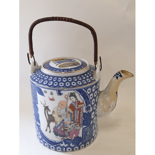 51 - Oriental Tea Pot with swing handle, 16cm high