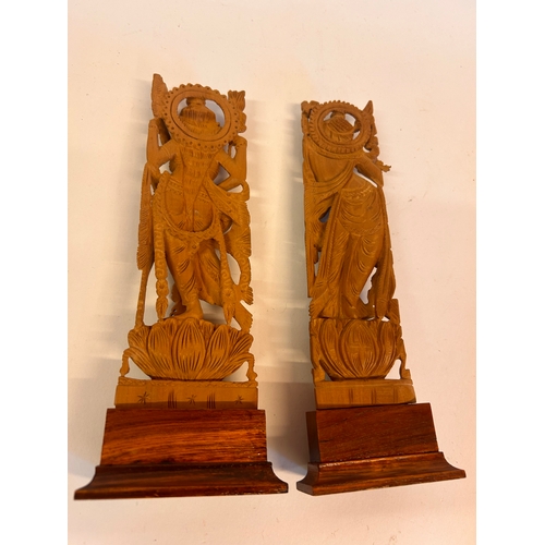 192 - Two Asian Wooden Figures. Measuring 24cm x 9cm.  (2)