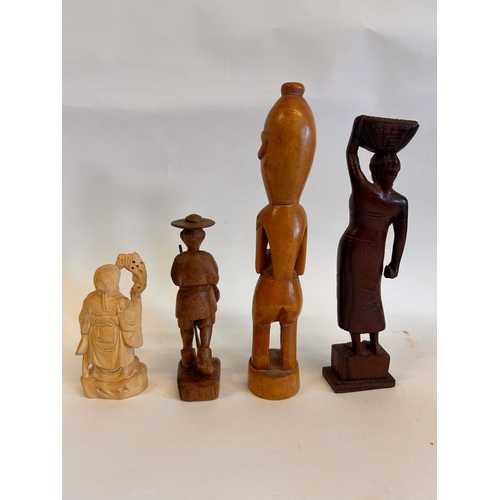 199 - Four Wooden Asian Figures. Largest Figure Measures  23 x 4cm.   (4)