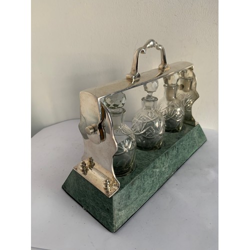 124 - 3 Bottle Tantalus On Marble Base (no key)
26 x 10 x 19.5 cms h