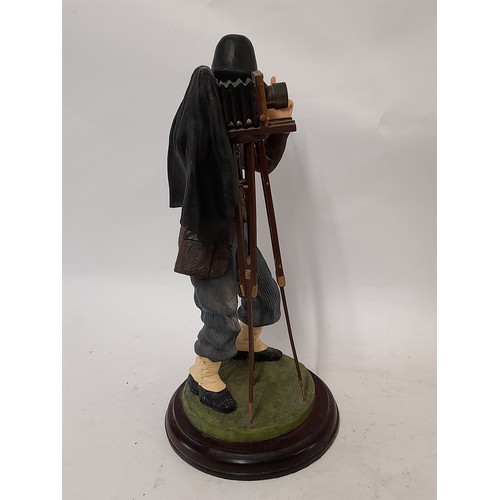 397 - The Fairweather Collection Resin Figure of a Photographer in action, 35cm high