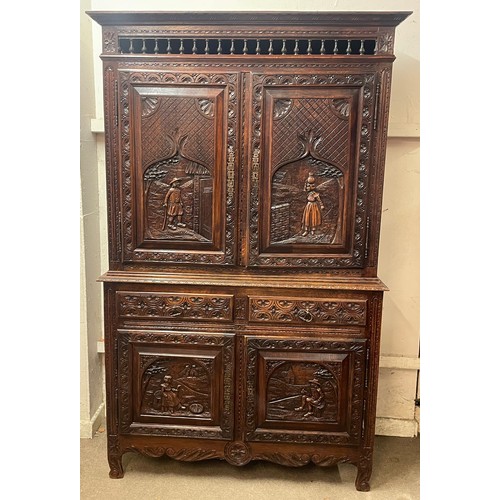 52 - Continental Two Piece Unit With Profusely Carved Panels. 211 x 128 x 42 cms