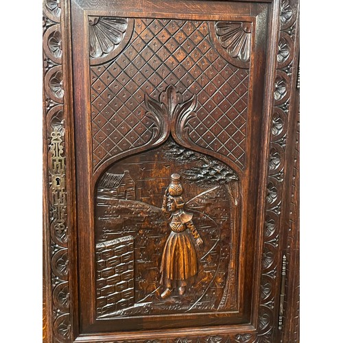 52 - Continental Two Piece Unit With Profusely Carved Panels. 211 x 128 x 42 cms