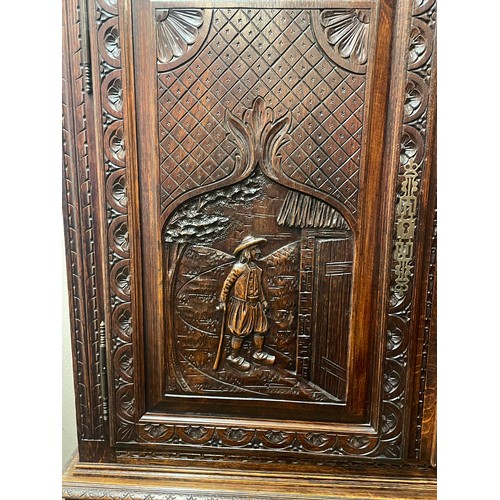 52 - Continental Two Piece Unit With Profusely Carved Panels. 211 x 128 x 42 cms