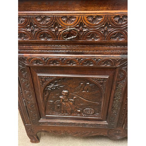 52 - Continental Two Piece Unit With Profusely Carved Panels. 211 x 128 x 42 cms