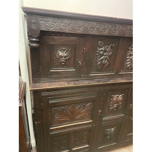 54 - Two Piece Continental Court Cupboard With Carved Wood Panels.162 x 170 x 56 cms