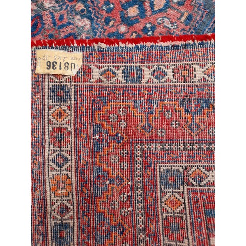 94 - Large Hand Knotted Red Ground Rug with Blue Pattern, 242cm x 169cm