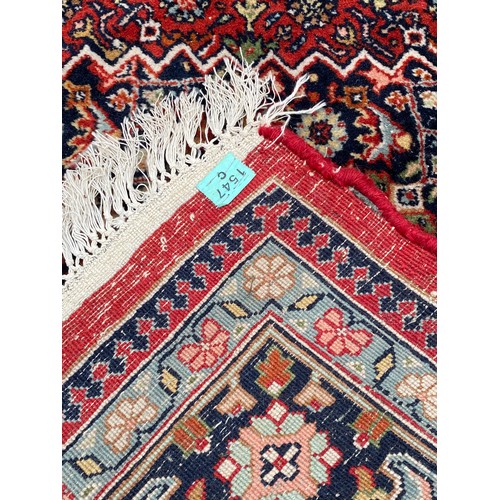 77 - Large Patterned Handmade Ground Rug with Label and Marking 253cm x 166cm