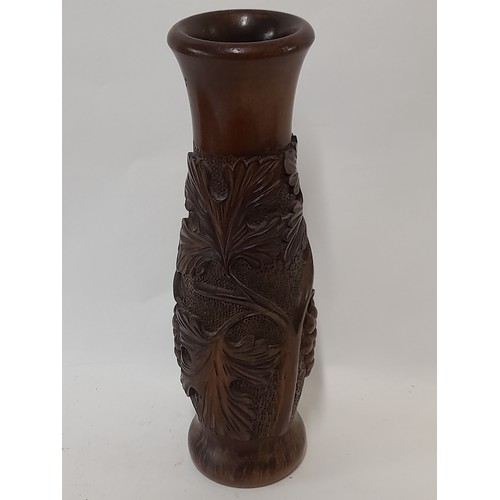 21 - Carved wood Vase with Grape Vine Design, 29cm high