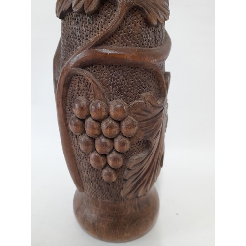 21 - Carved wood Vase with Grape Vine Design, 29cm high