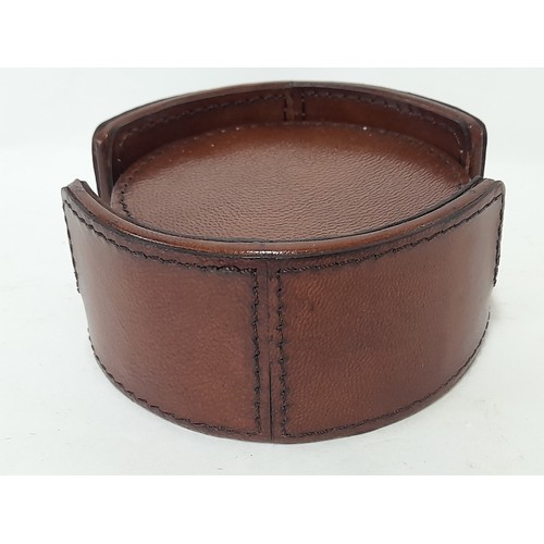 28 - 6 x Leather coasters in leather holder, 12cm dia