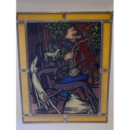 37 - Lead And Stained  Glass Window Panel of a man with dogs, 33cm x 42cm