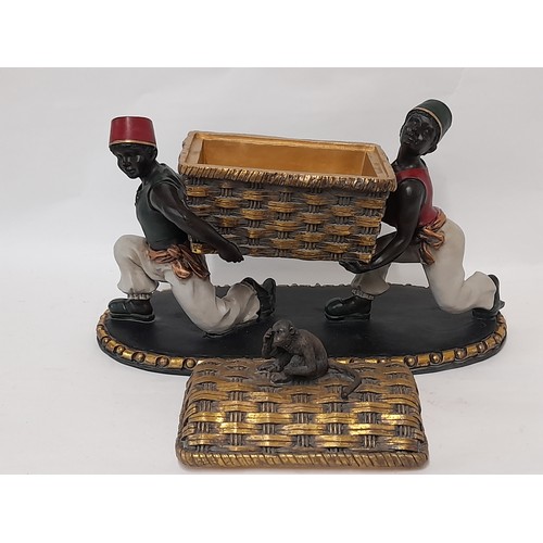 38 - Table centre piece of Blackamoor figures carrying a basket with removable lid with monkey finial, 35... 