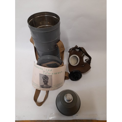 56 - WW2 Gas Mask with instructions in Tin Cannister