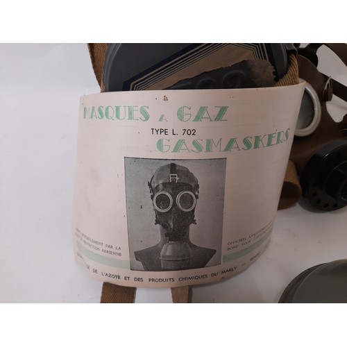 56 - WW2 Gas Mask with instructions in Tin Cannister