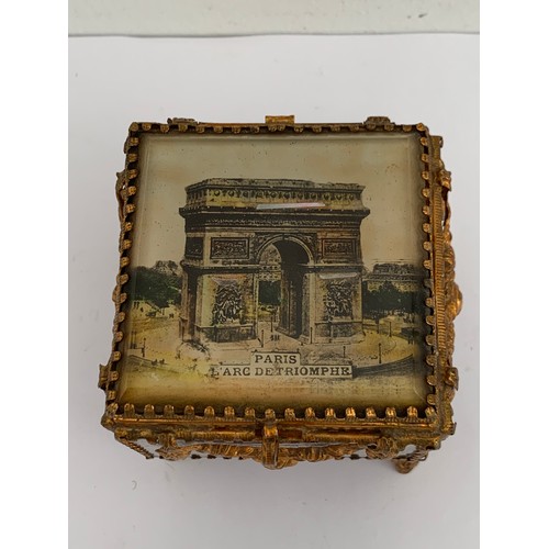 116 - Antique Gilt Brass And Glass Jewellery Casket Having L’Arc De Triomphe, Paris To The Top
8 x 8 x 7.5... 