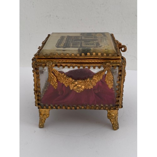 116 - Antique Gilt Brass And Glass Jewellery Casket Having L’Arc De Triomphe, Paris To The Top
8 x 8 x 7.5... 
