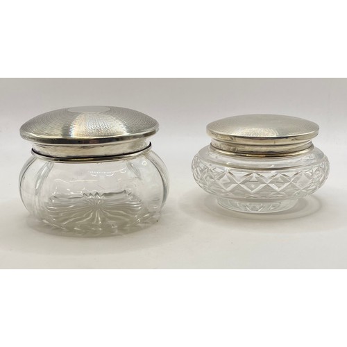 252 - Two Cut Glass Jars With Decorated Hallmarked Silver Lids. Silver Weight 1.935 Oz. Largest 10cm Diame... 