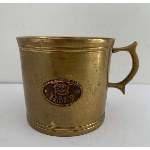 291 - WW1 Trench Art Bronze Mug With Handle Having HMS On Side
7 cms diameter x 6.5 cms h