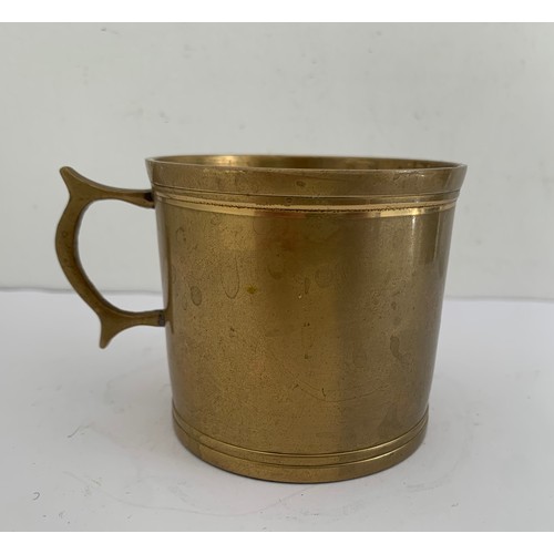 291 - WW1 Trench Art Bronze Mug With Handle Having HMS On Side
7 cms diameter x 6.5 cms h