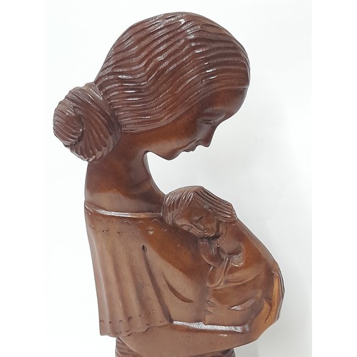 95 - Wood carved Mother and Child on Plinth, 39cm high