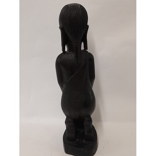 98 - Tribal wood carved figure of a kneeling woman, 37cm high