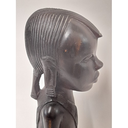 98 - Tribal wood carved figure of a kneeling woman, 37cm high