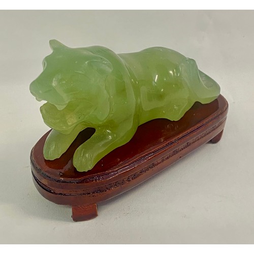 211 - Oriental  Green Jade Foo Dog Figure Raised on Wooden Base 10cm x 7cm