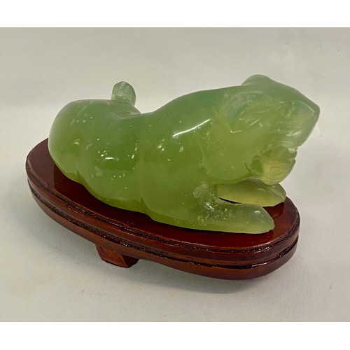 211 - Oriental  Green Jade Foo Dog Figure Raised on Wooden Base 10cm x 7cm