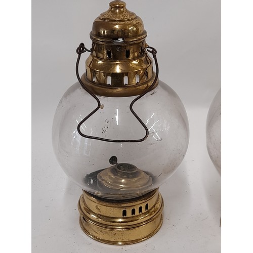 302 - Two Vintage Brass and Onion Glass Hanging Oil lamps, tallest  29cm high. (2)