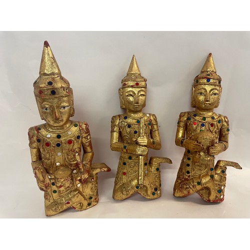 307 - Three Gilt Wood Buddha Figures Playing Musical Instrument's. 26 cms High (3)