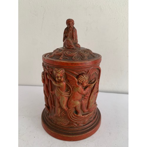 103 - Antique Terracotta Tobacco Jar Featuring Winged Cherubs And Having A Finial In The Form Of A Seated ... 