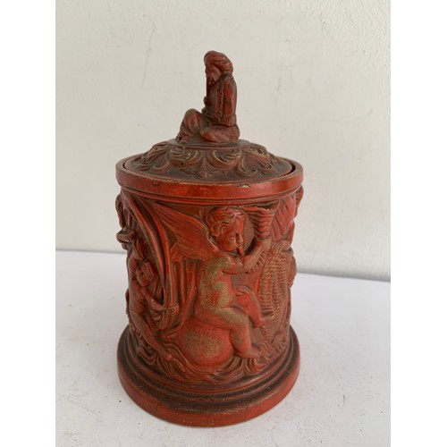 103 - Antique Terracotta Tobacco Jar Featuring Winged Cherubs And Having A Finial In The Form Of A Seated ... 