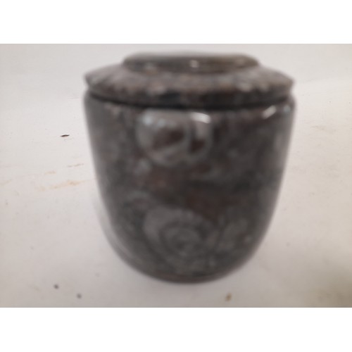 312 - Carved and Polished Stone lidded pot containing fossils, 6cm high