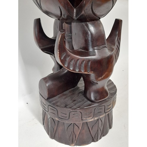 356 - Large Tribal Carving depicting two cattle heads and a bowl carved in the top, 62cm high