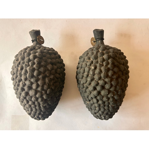 418 - Pair of stone pinecones. 25cm x 13cm x 11cm. (2)