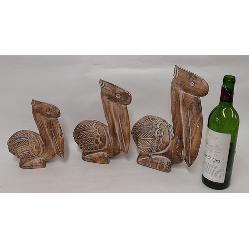 372 - 3 x wood carved graduated Pelican Figures , largest 30cm high