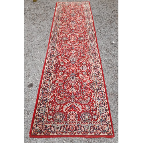 424 - Red Ground Runner with floral pattern, 295cm x 81cm