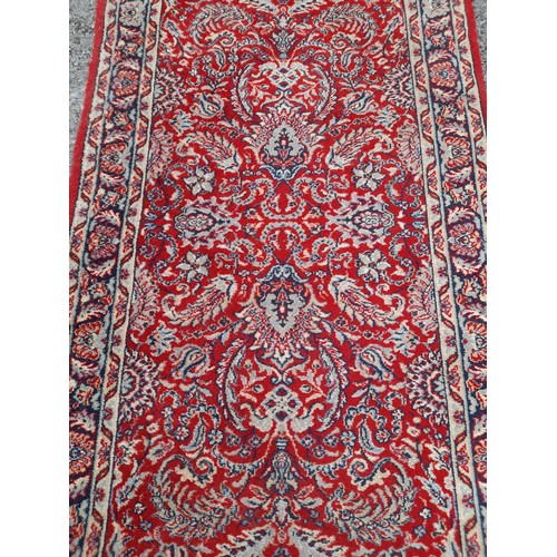 424 - Red Ground Runner with floral pattern, 295cm x 81cm