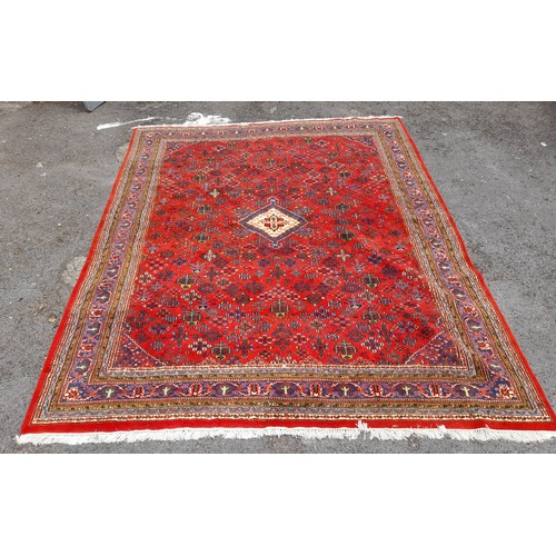 81 - Extra Large Country House Red Ground Hand Knotted Rug with blue diamond central motif, 383cm x 298cm