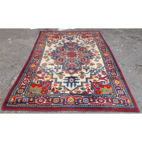 86 - Large multi coloured hand knotted rug, 287cm x 194cm