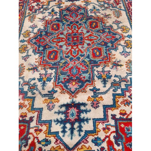 86 - Large multi coloured hand knotted rug, 287cm x 194cm