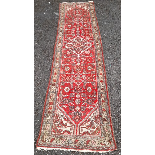 84 - Large Red ground Hand knotted Runner, 307cm x 78cm